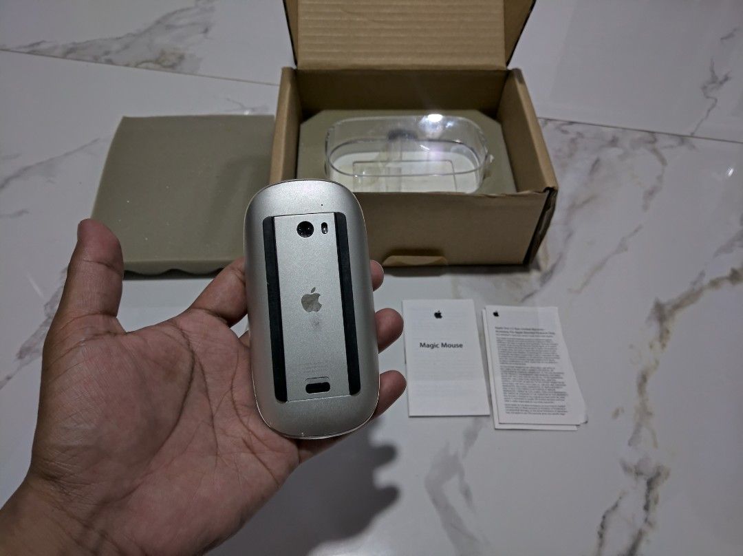 Apple Magic Mouse A1296 (White) (Category: Mouse & Mousepads) located in General Trias. Submitted by mervcorner (Listing ID 1469542534, Image 2). Description: Apple Magic Mouse (White) Model: A1296 1st Generation Includes manual, casing and box. ISSUE: defective (not turning on) Selling as is. For parts or repair. RFS: Decluttering Item Location: General Trias, Cavite Delivery thru Lalamove (At Buyer's expense) Contact 09918984245 if interested..