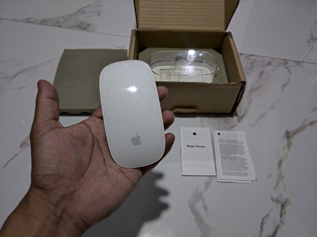 Apple Magic Mouse A1296 (White) (Category: Mouse & Mousepads) located in General Trias. Submitted by mervcorner (Listing ID 1469542534, Image 1). Description: Apple Magic Mouse (White) Model: A1296 1st Generation Includes manual, casing and box. ISSUE: defective (not turning on) Selling as is. For parts or repair. RFS: Decluttering Item Location: General Trias, Cavite Delivery thru Lalamove (At Buyer's expense) Contact 09918984245 if interested..