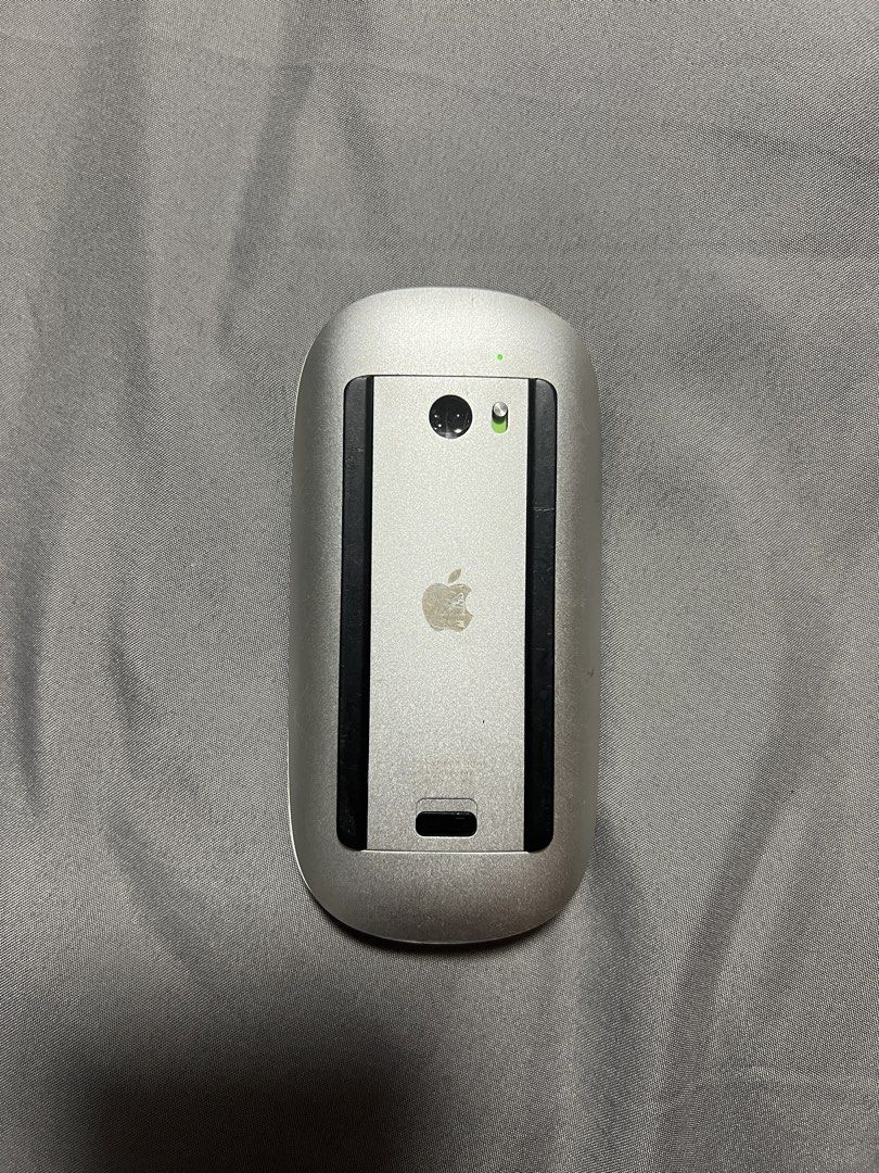 Apple Magic Mouse Version 1 (A1296) Battery Powered Wireless Mouse (Category: Mouse & Mousepads) located in Marikina City. Submitted by pepitsells (Listing ID 1469499967, Image 2). Description: classic Apple Magic Mouse Version 1 (A1296) with iconic white top and aluminum body powered by two easily replaceable AA batteries with a detachable cover all gestures work, I can send a video if needed standard Bluetooth wireless connection for seamless p