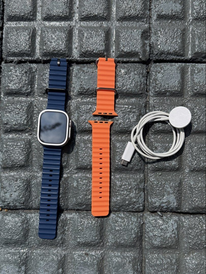Apple Watch Ultra (49mm with Cellular) (Category: Wearables & Smart Watches) located in Pasig City. Submitted by danachos (Listing ID 1469464757, Image 1). Description: • Color: Titanium • Battery Health: 98% • No box, but complete inclusions w/ charger • Comes with 2 premium straps, blue & orange Like brand new! Did not use, upgraded immediately.