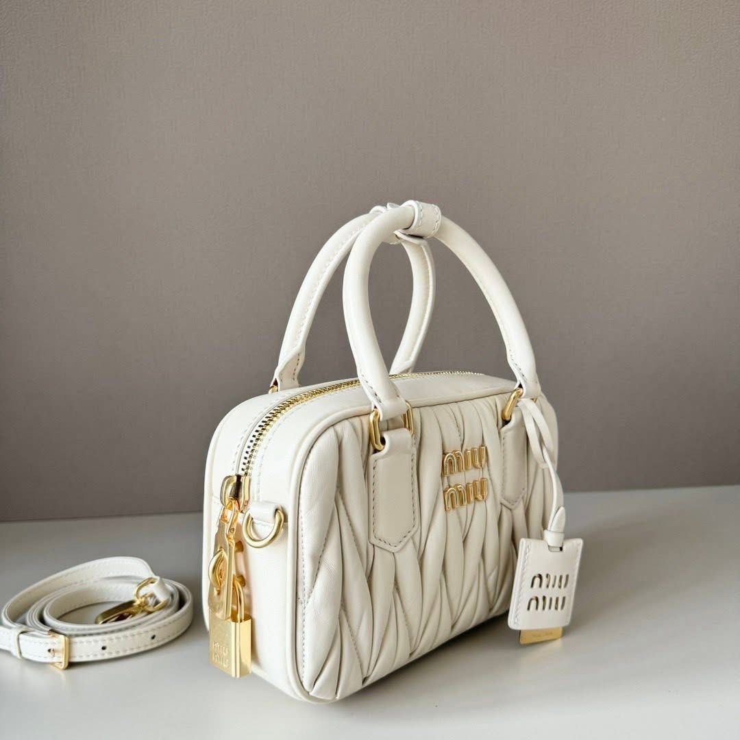 Arcadie Matelassé Nappa Leather Bag (Category: Luxury Bags & Wallets) located in Manila. Submitted by bagsandmanymanymore1 (Listing ID 1469433014, Image 2). Description: Miu Matelassé Leather Bag Leather handles Removable leather mirror case Gold tone hardware With purse feet Zipper closure What you see is what you get.