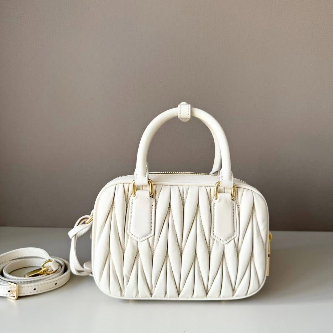 Arcadie Matelassé Nappa Leather Bag (Category: Luxury Bags & Wallets) located in Manila. Submitted by bagsandmanymanymore1 (Listing ID 1469433014, Image 3). Description: Miu Matelassé Leather Bag Leather handles Removable leather mirror case Gold tone hardware With purse feet Zipper closure What you see is what you get.