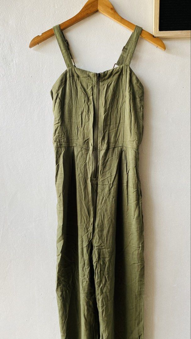 Art Class Olive Green Jumpsuit (Category: Jumpsuits) located in Caloocan City. Submitted by lovemyclothes21 (Listing ID 1469464670, Image 2). Description: - Brand: Art Class - Size: Medium - Color: Olive green - Closure: Front zipper - Straps: Adjustable - Fit: Straight leg cut with pleats at the waist - Style: Comfortable utility one-piece.