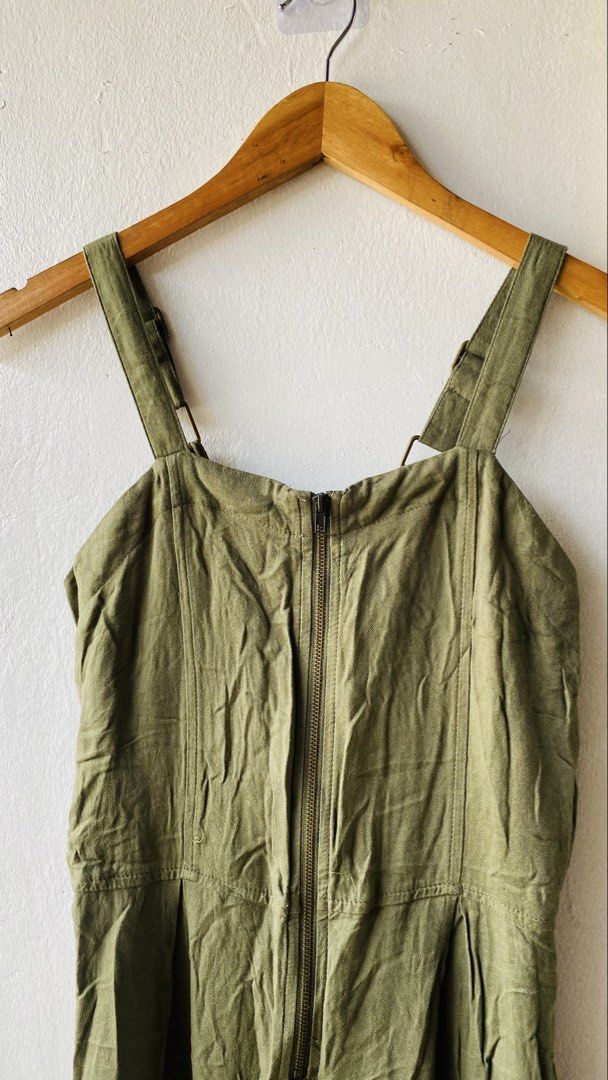 Art Class Olive Green Jumpsuit (Category: Jumpsuits) located in Caloocan City. Submitted by lovemyclothes21 (Listing ID 1469464670, Image 3). Description: - Brand: Art Class - Size: Medium - Color: Olive green - Closure: Front zipper - Straps: Adjustable - Fit: Straight leg cut with pleats at the waist - Style: Comfortable utility one-piece.