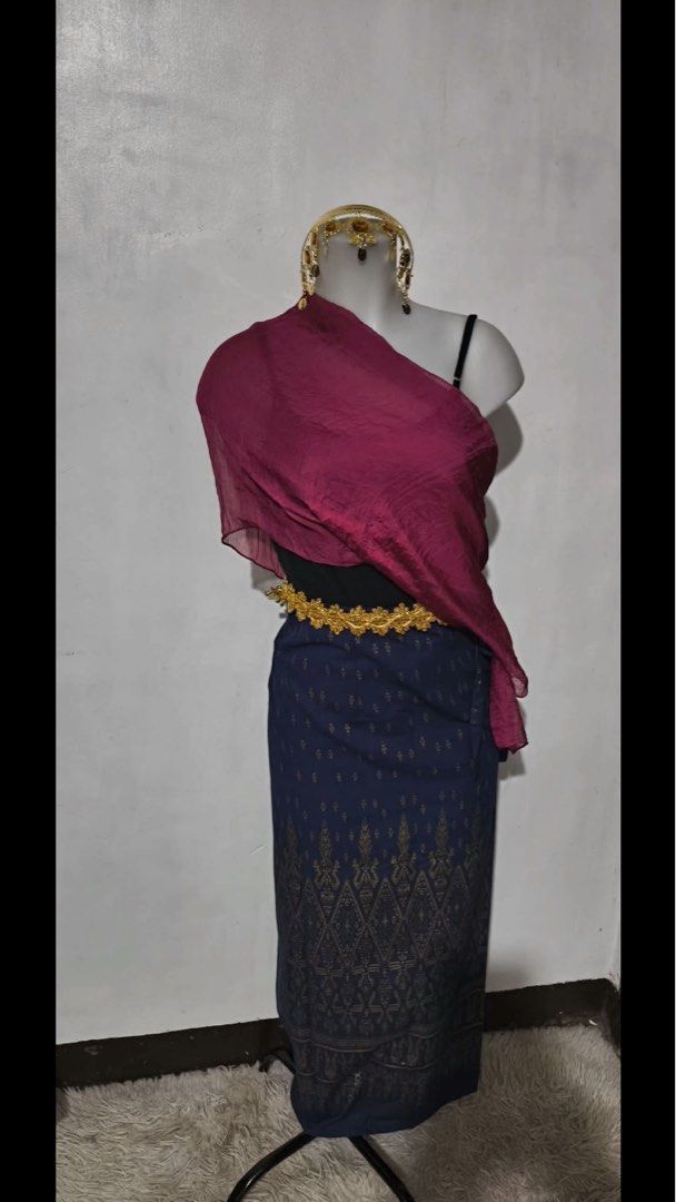 ASEAN Costume (Category: Traditional & Ethnic wear) located in Pasig City. Submitted by anbacani0334519 (Listing ID 1469488720, Image 1). Description: BELT, SKIRT, AND SASH ALREADY INCLUDED - Complete traditional Thai costume set - Color: Navy blue wrap skirt with gold patterns and deep magenta sash - Includes: Skirt, sash, ornate gold waist belt, and matching gold headpiece - Condition: Worn once, clean, and ready to wear - Perfect for cultural 