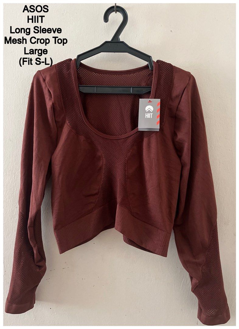 ASOS HIIT Long Sleeve Mesh Crop Top (Category: Longsleeves) located in Cebu City. Submitted by purgemycloset (Listing ID 1469421315, Image 2). Description: Brand new ASOS HIIT long sleeve crop top in deep -brown (UK 16-18 / Size L). Features breathable mesh panels and a supportive ribbed hem with logo detail. Tags still attached! Can fit small-large .