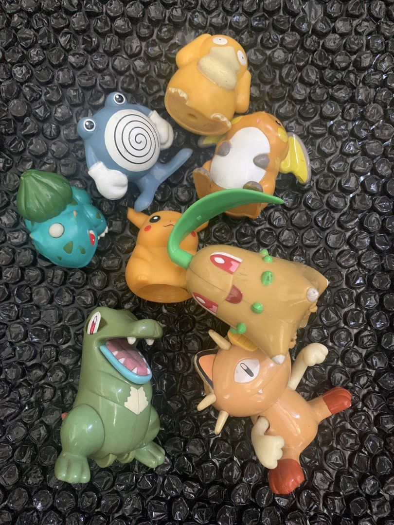 Assorted Pokemon Figure Toys Lot (Category: Figurines & Statues) located in Manila. Submitted by emenem.m (Listing ID 1469422090, Image 1). Description: - Set of 8 assorted Pokemon mini figures - Includes Psyduck, Poliwhirl, Bulbasaur, Pikachu, Chikorita, Feraligatr, Meowth, and Raichu - Features various dynamic poses - Perfect for collectors or kids' play - Minor paint wear due to previous use - Sold as a complete bundle only.