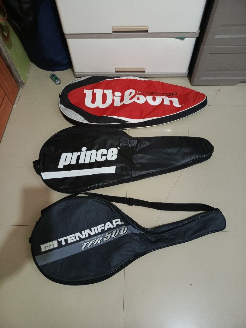 Assorted Tennis Racket Covers Wilson Prince Tennifar (Category: Racket and Ball Sports) located in Irosin. Submitted by whanchore55263 (Listing ID 1467106545, Image 2). Description: Three tennis racket covers up for grabs. Includes a red and black Wilson K Factor cover, a black Prince cover, and a black Tennifar TFR 500 cover with Japana tag inside. Solid zipper closures and soft interior lining on all three to keep rackets protected during trans