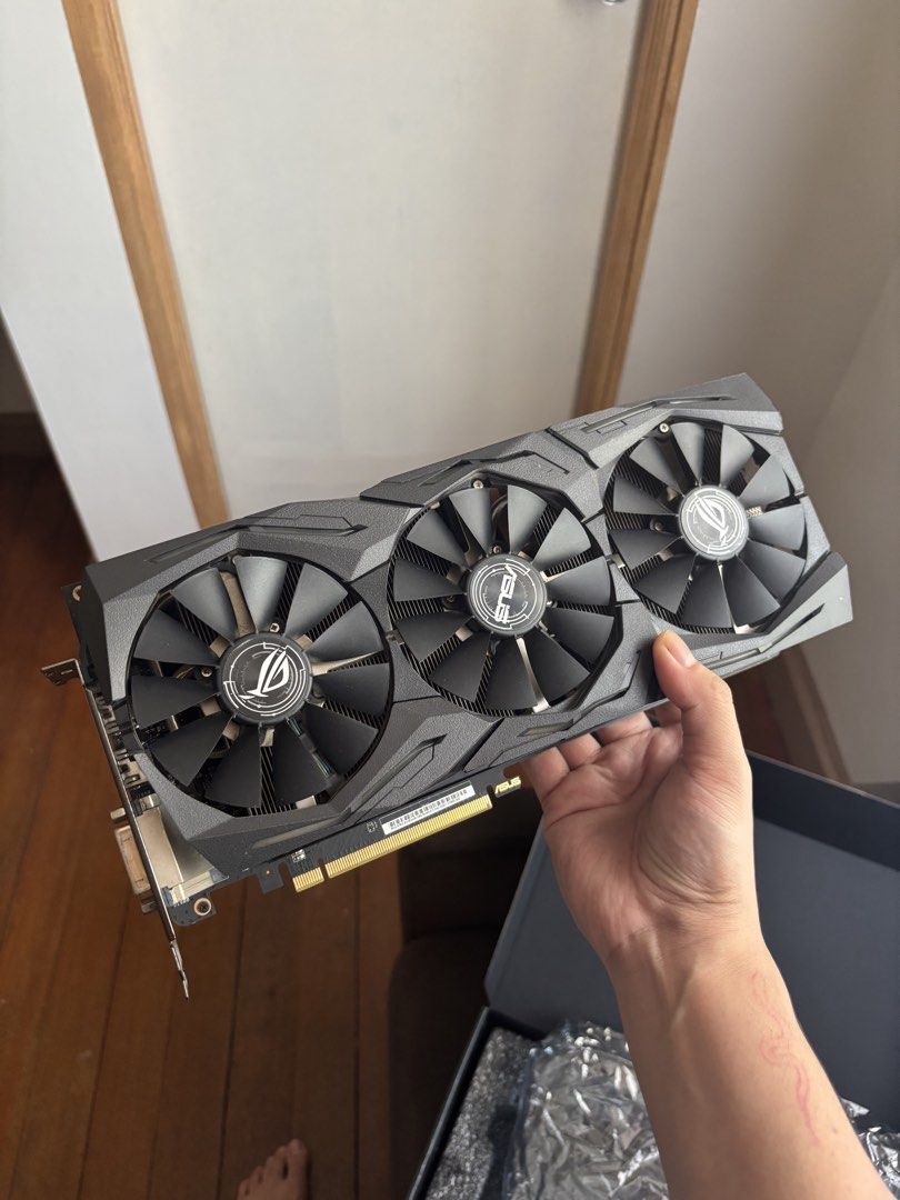 ASUS ROG Strix Radeon RX Vega 56 OC Edition (Category: Computer Parts) located in Pasig City. Submitted by tinymommy_ (Listing ID 1469482489, Image 2). Description: ASUS ROG Strix Radeon RX Vega 56 8G OC Edition VRAM: 8GB HBM2 Memory Ports: 2x HDMI, 2x DisplayPort, 1x DVI-D (Great for VR or multi-monitor setups) Power: Requires 2x 8-pin PCIe power cables (Recommended PSU: 650W or higher) • Strictly used on gaming and editing • Box included RFS: N