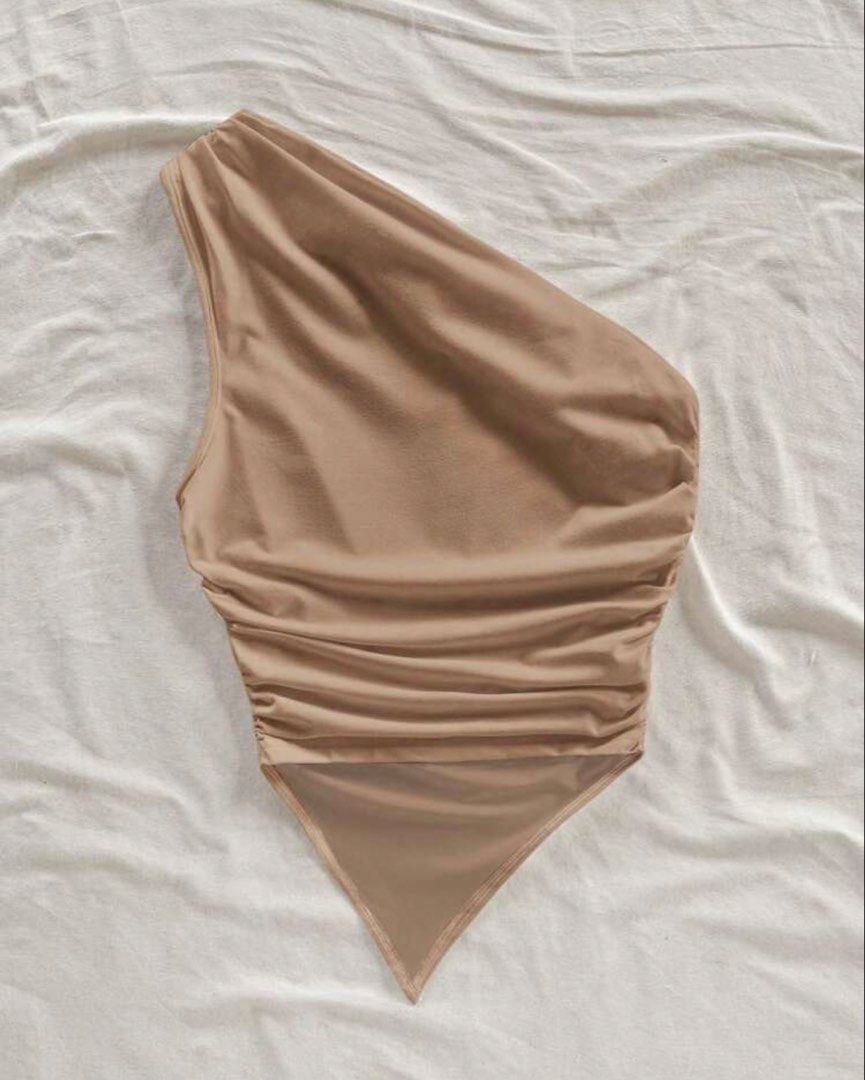 Asymmetrical Neck Top (Category: Others Tops) located in Iba. Submitted by wear1tagain (Listing ID 1469443966, Image 2). Description: ~ Khaki ~ 30 to 32 waistline ~ 34 to 36 bust ~ Large on tag ~ Never been used ~ From Shein ~ Original price : ₱152 ••••••••••••••••••• ~ J&T Delivery (outside Zambales) ~ Meet up within Iba, Zambales (at CSI Mall) ~ Shipping/Delivery fee shall be shouldered by the buyer.