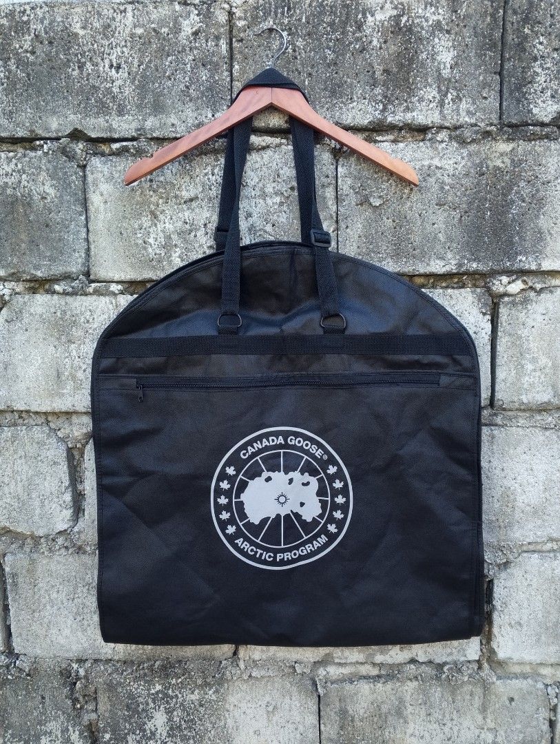 Authentic Canada Goose Arctic Program Foldable Travel Garment Carrier / Dust Bag (Category: Belt bags, Clutches and Pouches) located in Baliuag. Submitted by retrovault83 (Listing ID 1469412348, Image 1). Description: ✨ Condition: 8.5/10 – Great Preloved Condition (Minor flaw noted below) ​📏 Measurements (Flat Lay, Unfolded / Travel Garment Bag): • Length: 24 • Width: 52 ​✅ Details: • Durable black non-woven poly-fabric construction designed for