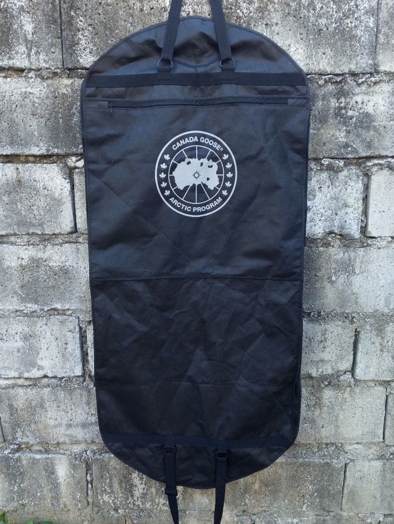Authentic Canada Goose Arctic Program Foldable Travel Garment Carrier / Dust Bag (Category: Belt bags, Clutches and Pouches) located in Baliuag. Submitted by retrovault83 (Listing ID 1469412348, Image 2). Description: ✨ Condition: 8.5/10 – Great Preloved Condition (Minor flaw noted below) ​📏 Measurements (Flat Lay, Unfolded / Travel Garment Bag): • Length: 24 • Width: 52 ​✅ Details: • Durable black non-woven poly-fabric construction designed for
