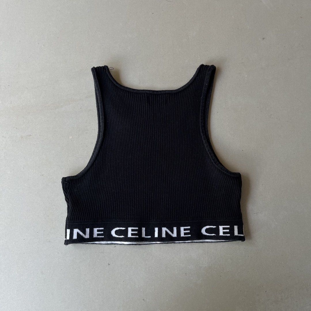 Authentic Celine Ribbed Wool Crop Top Black White Logo (Category: Shirts) located in Mandaue City. Submitted by chinsyap_03 (Listing ID 1469465975, Image 3). Description: - Brand: Celine - Style: Ribbed knit crop top with scoop neckline and racerback - Color: Black with contrast white Celine branding around the hem - Material: 100% wool, made in Italy - Condition/Details: Interior tag and care label intact - Size: Measures 13 x 13 inches (fits sm