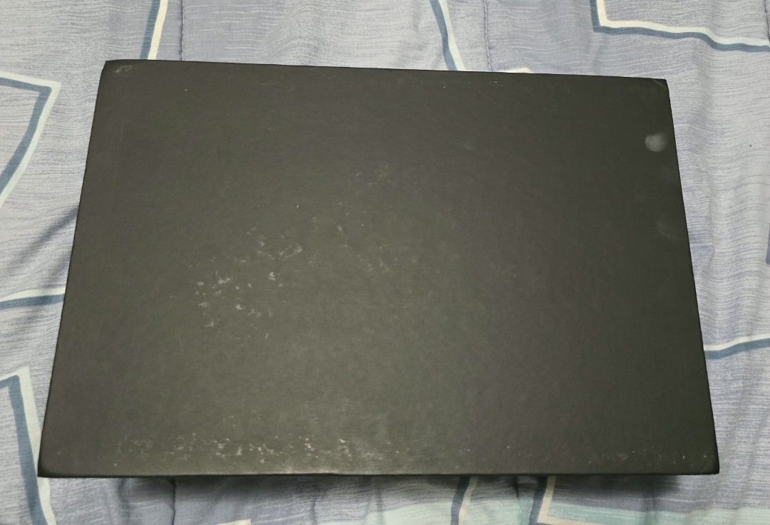 Authentic Chanel Box (from a Chanel Le Boy Old Medium (Category: Storage Boxes & Baskets) located in Las Pinas. Submitted by insouciant_worrier (Listing ID 1469556467, Image 2). Description: - Authentic black Chanel bag box featuring the classic white logo on top - Sturdy, rigid construction with a secure magnetic closure - Generous rectangular size with a clean interior - Condition: Minor surface scuffs and slight wear on one corner edge.