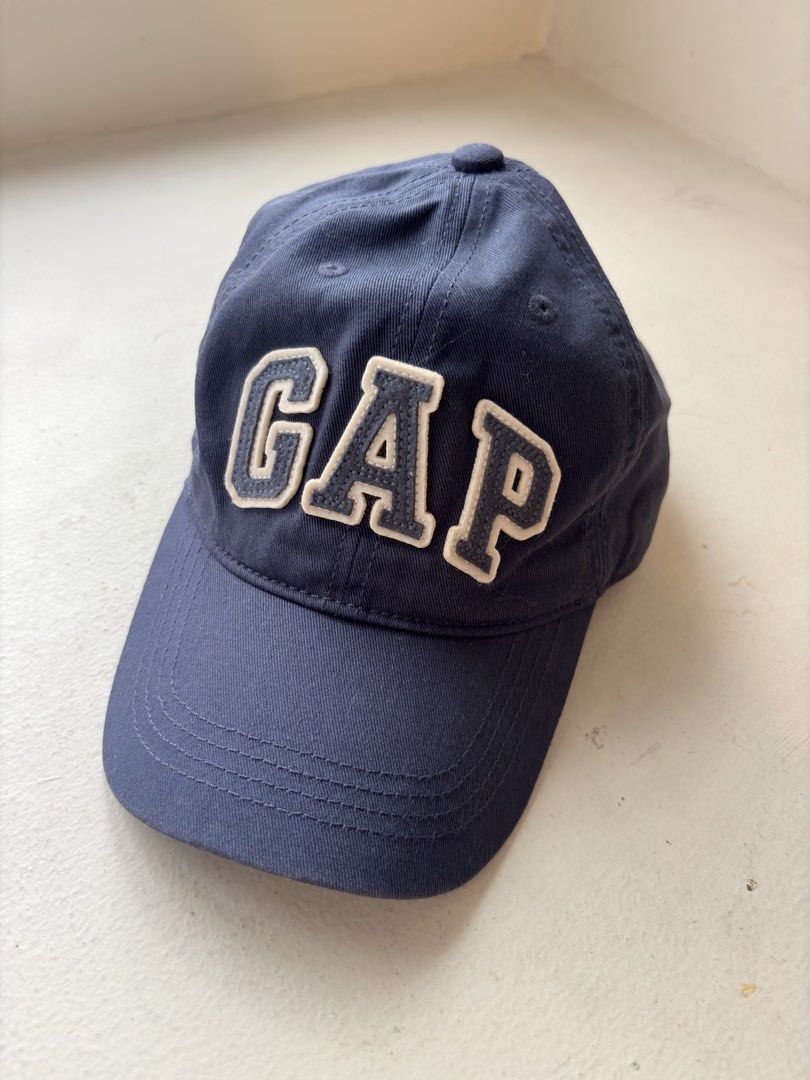 Authentic Gap Logo Baseball Cap (Category: Caps & Hats) located in Mandaluyong City. Submitted by material_boi (Listing ID 1469412454, Image 1). Description: Iconic design. Store bought at GAP store in Shangri-La for ₱1,500 i think. Washed navy blue color. Velcro closure. Maganda. Very classic. No worry about being deformed kasi di siya structured. This is actually for kids pero this is XL size so kasya to sa adults, in fact malalim siya. Issue: 