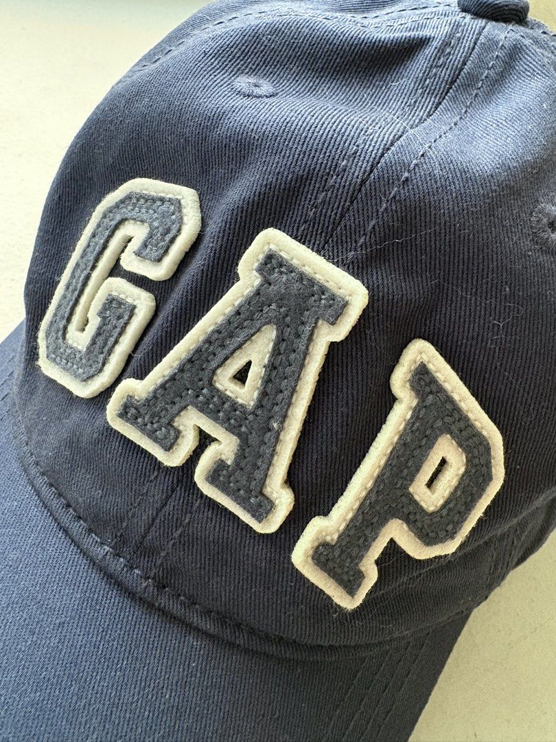 Authentic Gap Logo Baseball Cap (Category: Caps & Hats) located in Mandaluyong City. Submitted by material_boi (Listing ID 1469412454, Image 3). Description: Iconic design. Store bought at GAP store in Shangri-La for ₱1,500 i think. Washed navy blue color. Velcro closure. Maganda. Very classic. No worry about being deformed kasi di siya structured. This is actually for kids pero this is XL size so kasya to sa adults, in fact malalim siya. Issue: 