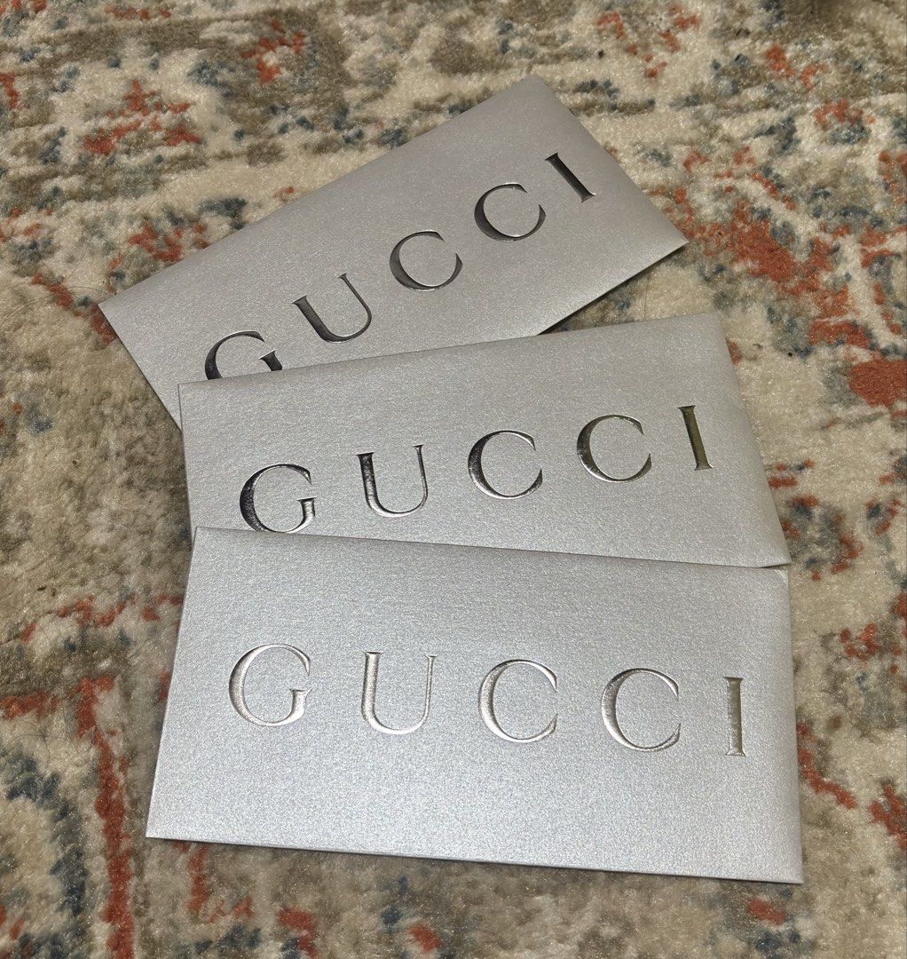Authentic Gucci Silver Envelope with Card and Adhesive (Category: Luxury Bags & Wallets) located in Manila. Submitted by nikashoppe (Listing ID 1469526092, Image 2). Description: Gucci silver envelopes with embossed branding (350 ea) - Comes with 1 white card featuring the matching Gucci logo - Ideal for gifting, collection, or enhancing item presentation.
