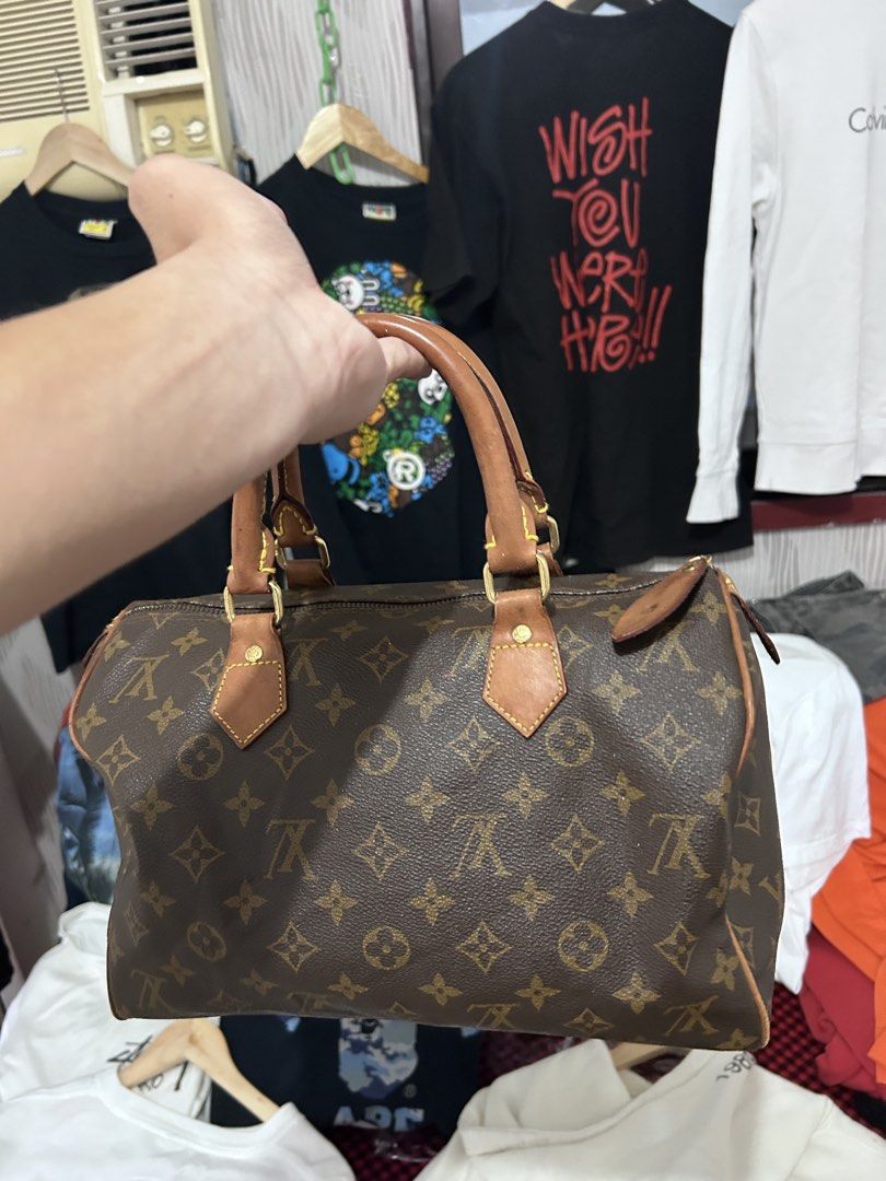 Authentic Louis Vuitton Speedy Monogram Handbag (Category: Luxury Bags & Wallets) located in Manila. Submitted by garmentfinds.01 (Listing ID 1469526776, Image 2). Description: - Authentic Louis Vuitton Monogram Speedy (Model M41526) - Crafted from iconic brown monogram coated canvas - Classic natural Vachetta leather handles and trim - Elegant gold-tone hardware details - Brown fabric-lined interior featuring a handy slip pocket - Stamped 'Louis