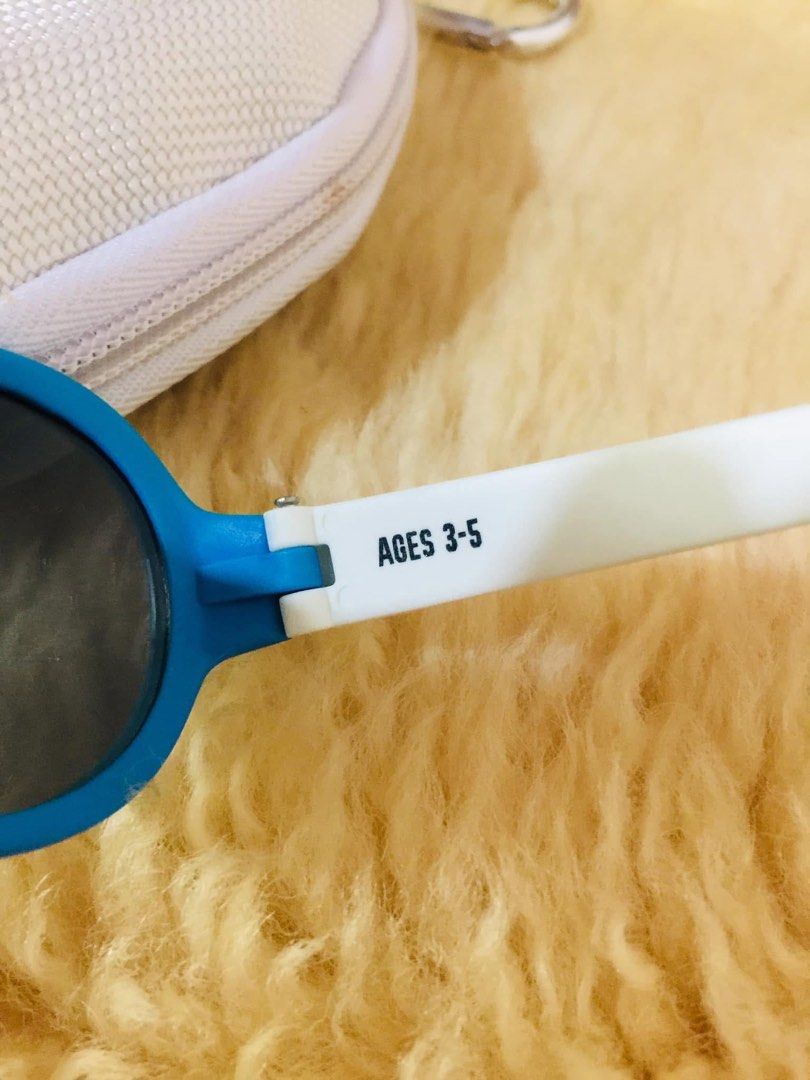 Babiators Kids Sunglasses Ages 3-5 with Case (Category: Babies & Kids Fashion) located in Baguio. Submitted by izza_thrifty (Listing ID 1469567975, Image 2). Description: - Brand: Babiators - Color: Blue and white with fun sneaker pattern on temples - Size: Kids ages 3 to 5 years old - Protection: Dark tinted lenses for reliable sun protection - Inclusion: Matching white hard zipper case with carabiner clip - Ideal for: Outdoor play and sunny day