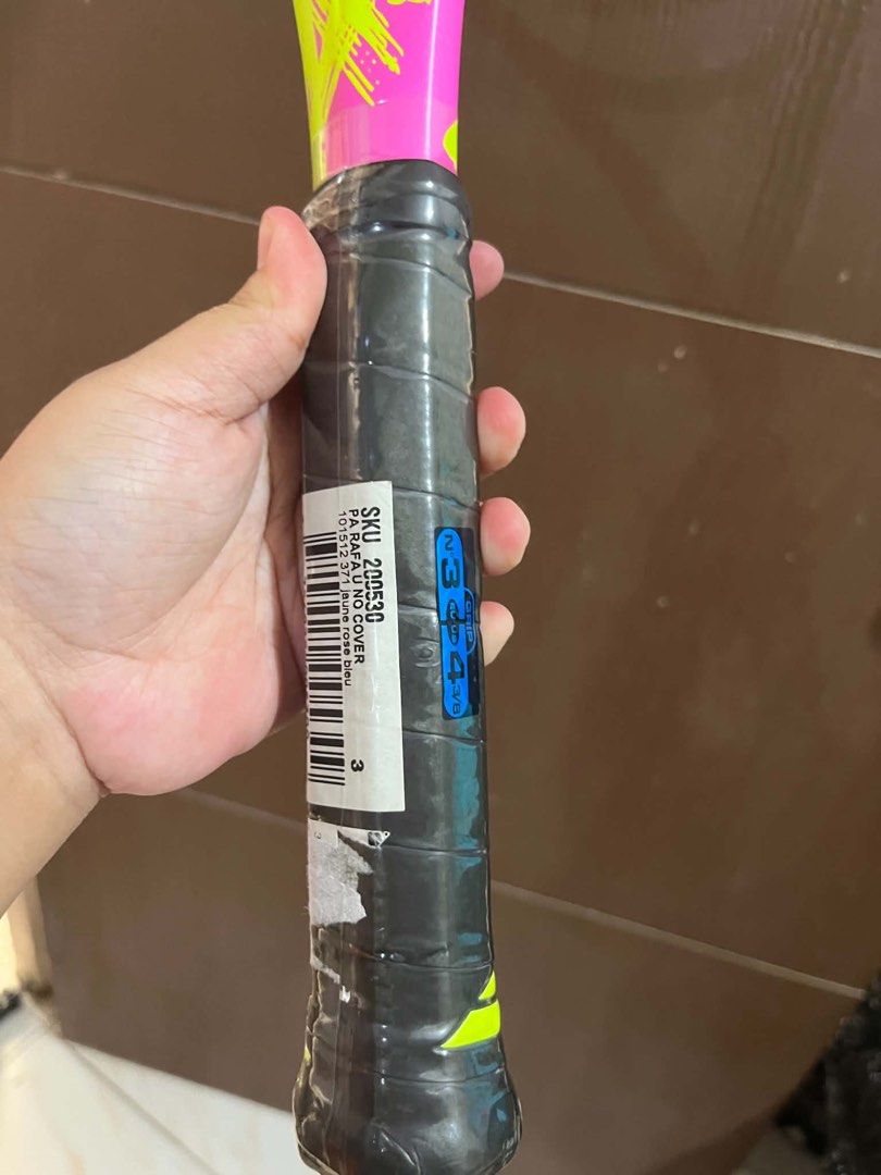 Babolat Aero Rafa 2023 (Category: Racket and Ball Sports) located in Batangas. Submitted by thrift.lab (Listing ID 1469514646, Image 3). Description: Babolat Pure Aero Rafa (290g) 3 : 4 3/8 (Grip 3). Racket Specifications (Unstrung) * Weight: 290 g / 10.2 oz * Head Size: 645 cm² / 100 sq. in. * Length: 685 mm / 27 in * Balance: 330 mm (+/- 7) / 4 pts HL * String Pattern: 16 mains / 19 crosses * Composition: Graphite Selling for 13k negotiable pa 