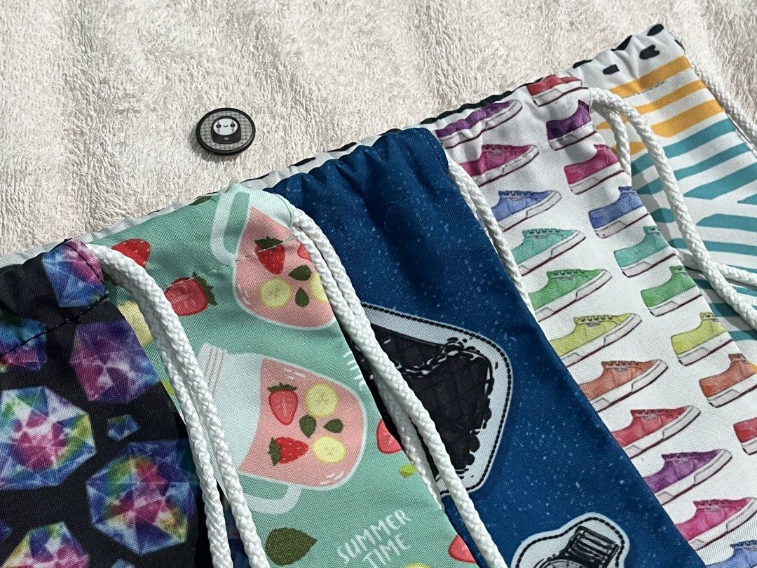 Bag For Sale | Assorted Drawstring Bags (Category: Tote Bags) located in San Jose del Monte. Submitted by preloved.to.newlove (Listing ID 1469464218, Image 1). Description: TAKE 3 - ₱50 OFF TAKE ALL - ₱700! SAVE ₱100! ☑️ Washed, waterproof, ready to pack ☑️ Can provide video upon request ☑️ Solo Code: PTNLW608 (Design) ☑️ Take All Code: PTNLW609 🛍️ OPTIONS 🛍️ 1. Multicolor Geometric design 2. Multicolor Sneaker design 3. Blue Bags & Makeup desi