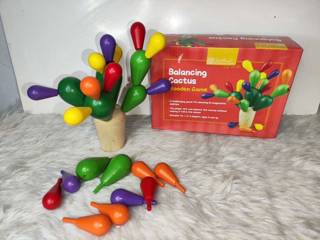 Balancing Cactus Wooden Game for Kids (Category: Educational & Learning Toys) located in Cavite. Submitted by tinetaclesss (Listing ID 1469553713, Image 1). Description: - Fun and engaging wooden balancing cactus game - Helps kids develop planning and imaginative abilities - Includes a sturdy wooden base and colorful cactus pieces in green, red, yellow, orange, and purple - .