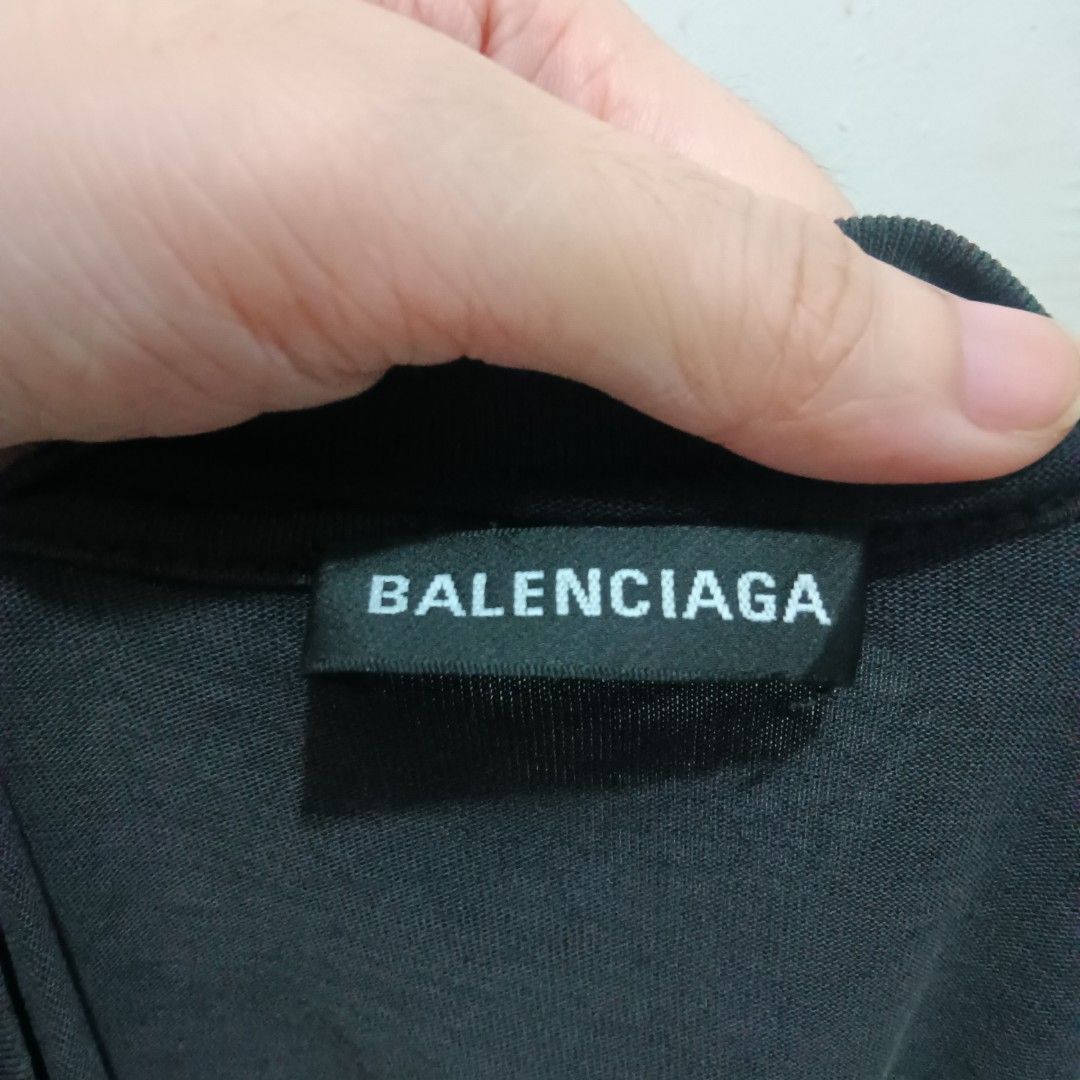 BALENCIAGA Black Shirt (Category: Tshirts & Polo Shirts ) located in Caloocan City. Submitted by jaychingsss (Listing ID 1469499321, Image 3). Description: Balenciaga Shirt - 250 23x28 Color Rate: 9.5/10 Complete Tags Minor issue: hairlines NEED WASH.