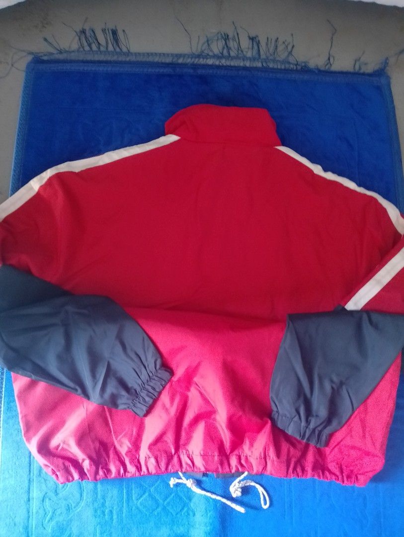 Balenciaga Colorblock Windbreaker Jacket (Category: Coats, Jackets and Outerwear) located in Manila. Submitted by wonderboi80 (Listing ID 1469401634, Image 2). Description: - Brand: Balenciaga - Design: Bold colorblock (Red, White, Dark Blue) with vertical front logo - Features: Full zip closure, stand collar, breathable mesh lining - Fit: Adjustable drawstring hem and elastic cuffs - Origin: Made in Portugal - Condition: Premium streetwear piece