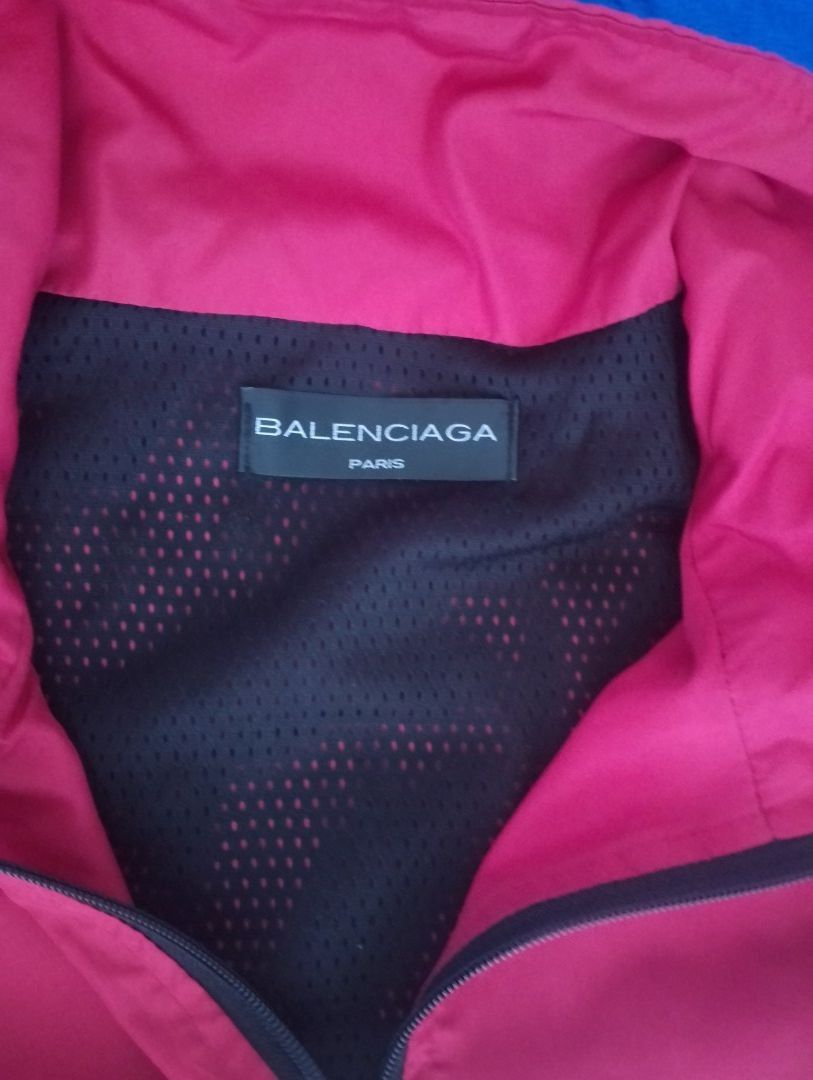 Balenciaga Colorblock Windbreaker Jacket (Category: Coats, Jackets and Outerwear) located in Manila. Submitted by wonderboi80 (Listing ID 1469401634, Image 3). Description: - Brand: Balenciaga - Design: Bold colorblock (Red, White, Dark Blue) with vertical front logo - Features: Full zip closure, stand collar, breathable mesh lining - Fit: Adjustable drawstring hem and elastic cuffs - Origin: Made in Portugal - Condition: Premium streetwear piece