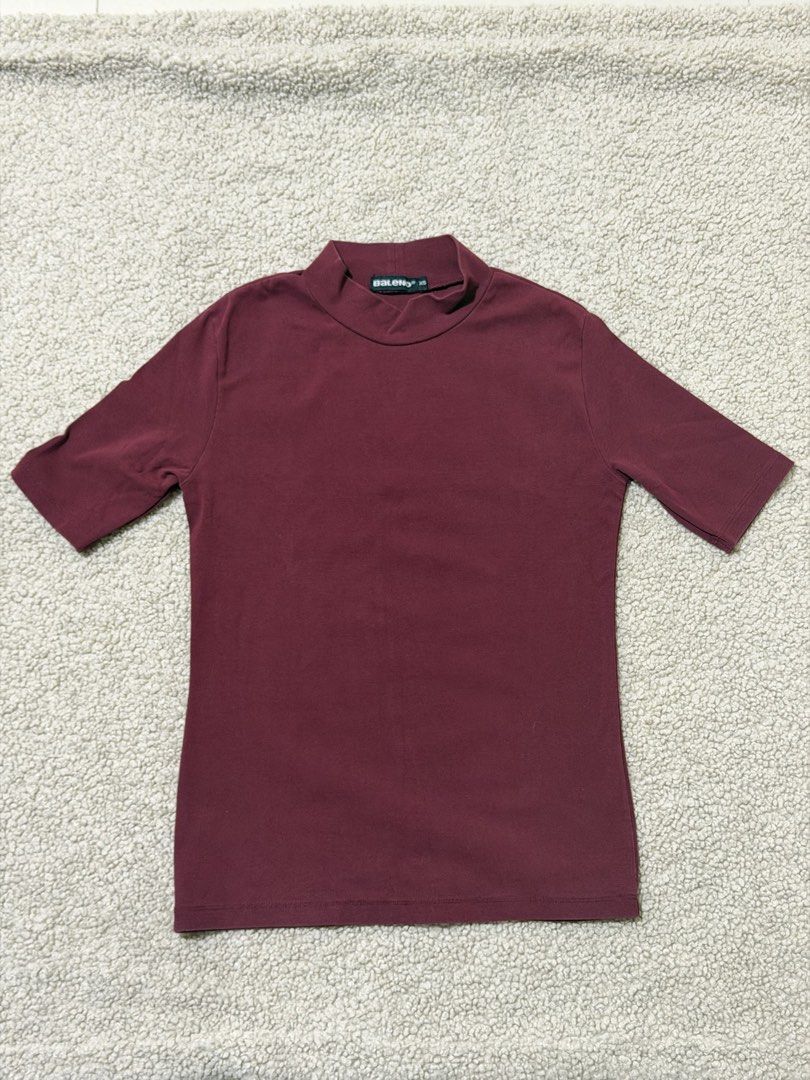 Baleno Maroon Mock Neck Short Sleeve Top (Category: Shirts) located in Las Pinas. Submitted by ann.co. (Listing ID 1469544343, Image 1). Description: - Brand: Baleno - Style: Short sleeve mock neck top - Color: Dark Maroon - Size: XS - Material: Stretchy cotton blend - Condition: Clean hem and neckline, excellent everyday basic.