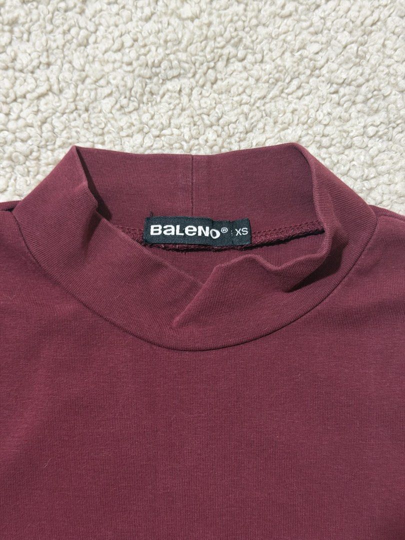 Baleno Maroon Mock Neck Short Sleeve Top (Category: Shirts) located in Las Pinas. Submitted by ann.co. (Listing ID 1469544343, Image 2). Description: - Brand: Baleno - Style: Short sleeve mock neck top - Color: Dark Maroon - Size: XS - Material: Stretchy cotton blend - Condition: Clean hem and neckline, excellent everyday basic.