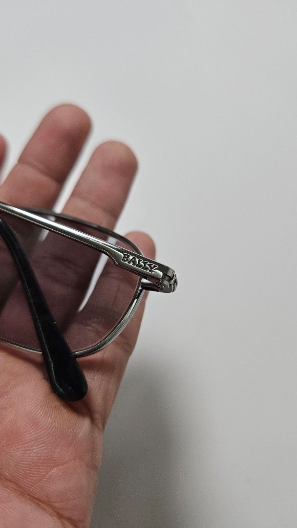 Bally B-7604 Sunglasses Metal Frame (Category: Sunglasses & Eyewear) located in Alfonso. Submitted by jbcamet (Listing ID 1469516167, Image 3). Description: - Brand: Bally - Model: B-7604 - Frame: Sturdy metal construction with clean hinges - Lenses: Grey tinted - Size Specs: 53-19-140 (marked on temple) - Details: Clear branding stamped near the temple joint - Condition/Style: Classic metal aesthetic, great for daily wear.