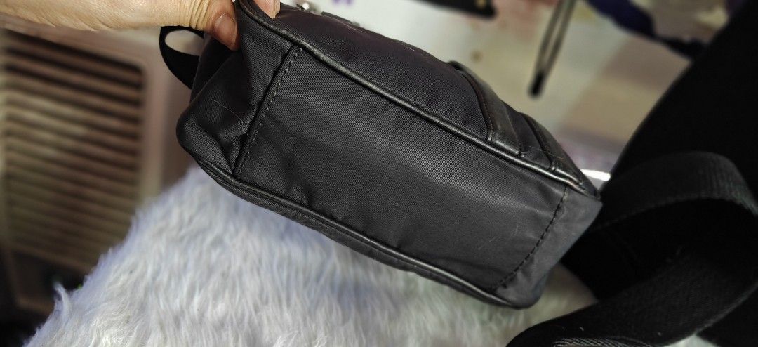 Bally Black Nylon Crossbody Bag (Category: Sling Bags) located in Las Pinas. Submitted by liezel49 (Listing ID 1469424224, Image 3). Description: - Brand: Bally Crossbody Bag - Material: Durable black nylon with sleek leather trim - Storage: Secure zip-top closure plus an extra zipped front pocket - Strap: Comfortable, adjustable wide shoulder strap - Condition: Clean interior with sturdy hardware throughout - Size: Compact design, ideal for dail