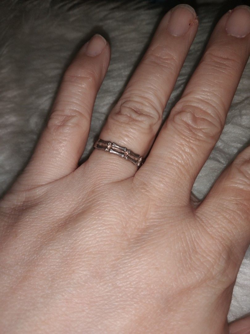 Bamboo design ring silver size 8 (Category: Rings) located in Quezon City. Submitted by eidorableshop (Listing ID 1469398852, Image 1). Description: - Style: Silver-tone ring with a unique segmented bamboo pattern all around the band - Design: Slim profile, lightweight, and perfect for stacking with other rings - Condition: Shows some wear marks and minor tarnishing on the inner side (does not affect outer appearance) - Material: Lightweight meta
