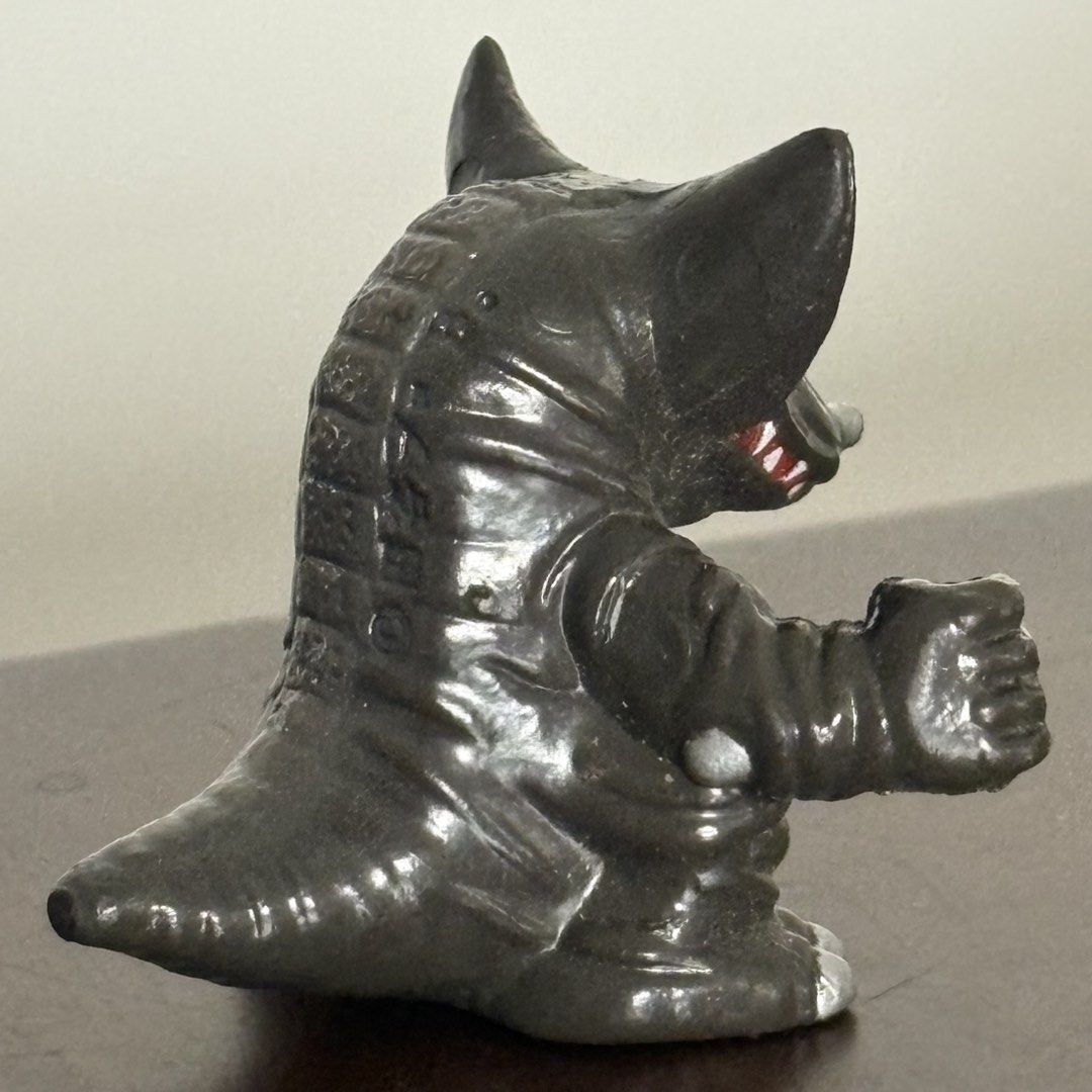 Bandai Ultraman Kaiju Neronga Figure (Category: Figurines & Statues) located in Manila. Submitted by aobacafe (Listing ID 1469455040, Image 3). Description: - Character: Neronga from Ultraman - Color: Black and silver with striking red zigzag markings on the ears - Material: Sturdy, high-quality vinyl that stands well on flat surfaces - Design: Detailed scaly texture on belly and back with an open mouth showing white teeth - Authenticity: Feature