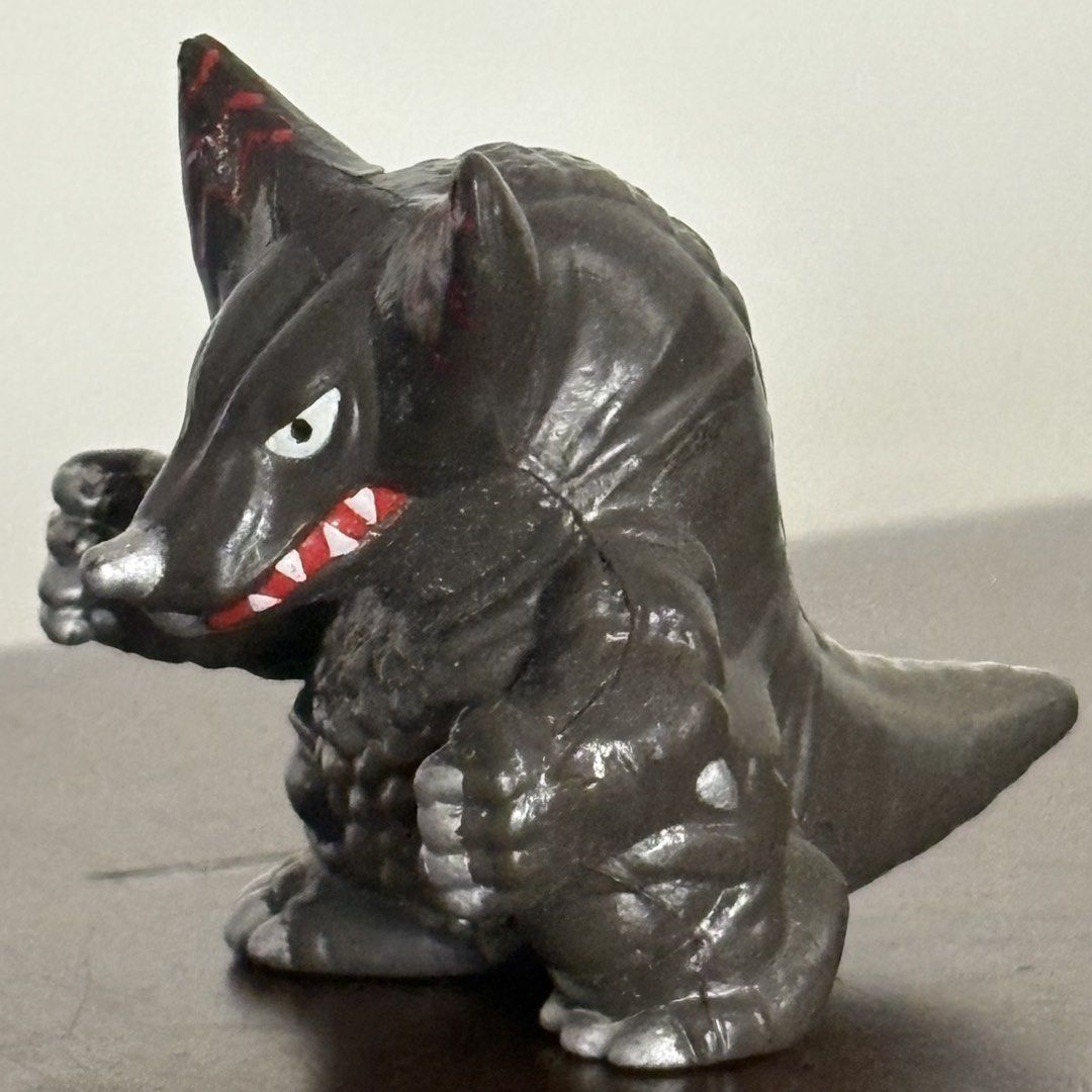 Bandai Ultraman Kaiju Neronga Figure (Category: Figurines & Statues) located in Manila. Submitted by aobacafe (Listing ID 1469455040, Image 2). Description: - Character: Neronga from Ultraman - Color: Black and silver with striking red zigzag markings on the ears - Material: Sturdy, high-quality vinyl that stands well on flat surfaces - Design: Detailed scaly texture on belly and back with an open mouth showing white teeth - Authenticity: Feature