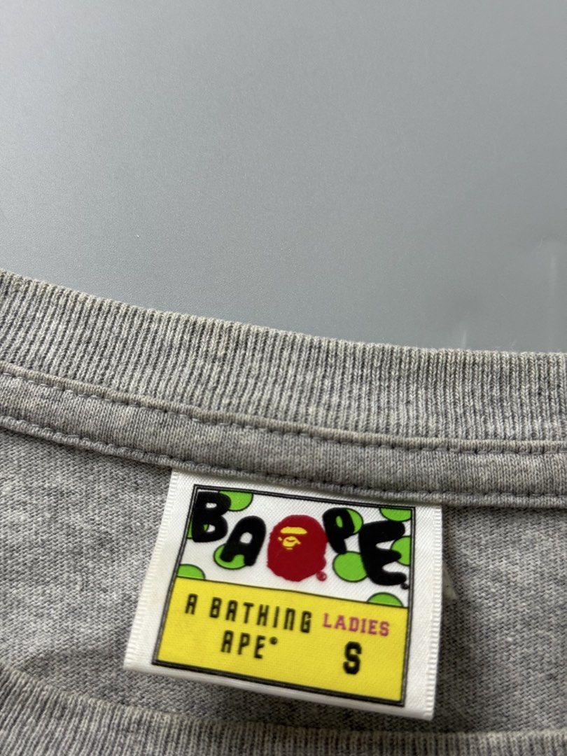 Bape head women (Category: Shirts) located in Pila. Submitted by villanueva80826 (Listing ID 1469526274, Image 3). Description: Bape women Size:small •Width:18.5 •Length:31 •Condition:9/10 •Color rate:9/10 Mine:680 +Shipping fee Issue:sign of usage like stretch hairline not noticeable ,light yellow stain Still in good condition Still wearable .