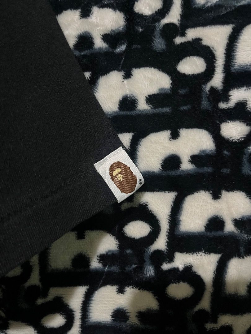 BAPE Shark Tee Black (Category: Tshirts & Polo Shirts ) located in Valencia. Submitted by vncnttroy (Listing ID 1469440187, Image 3). Description: - Authentic - Brand: BAPE (A Bathing Ape) - Item: Shark Graphic T-Shirt - Color: Solid Black - Size: Large - Details: Iconic center shark face print, Baby Milo inside the mouth, left cuff sleeve tag, and classic crewneck cut - Condition: Excellent, clean graphic with no fading - 21 x 28.