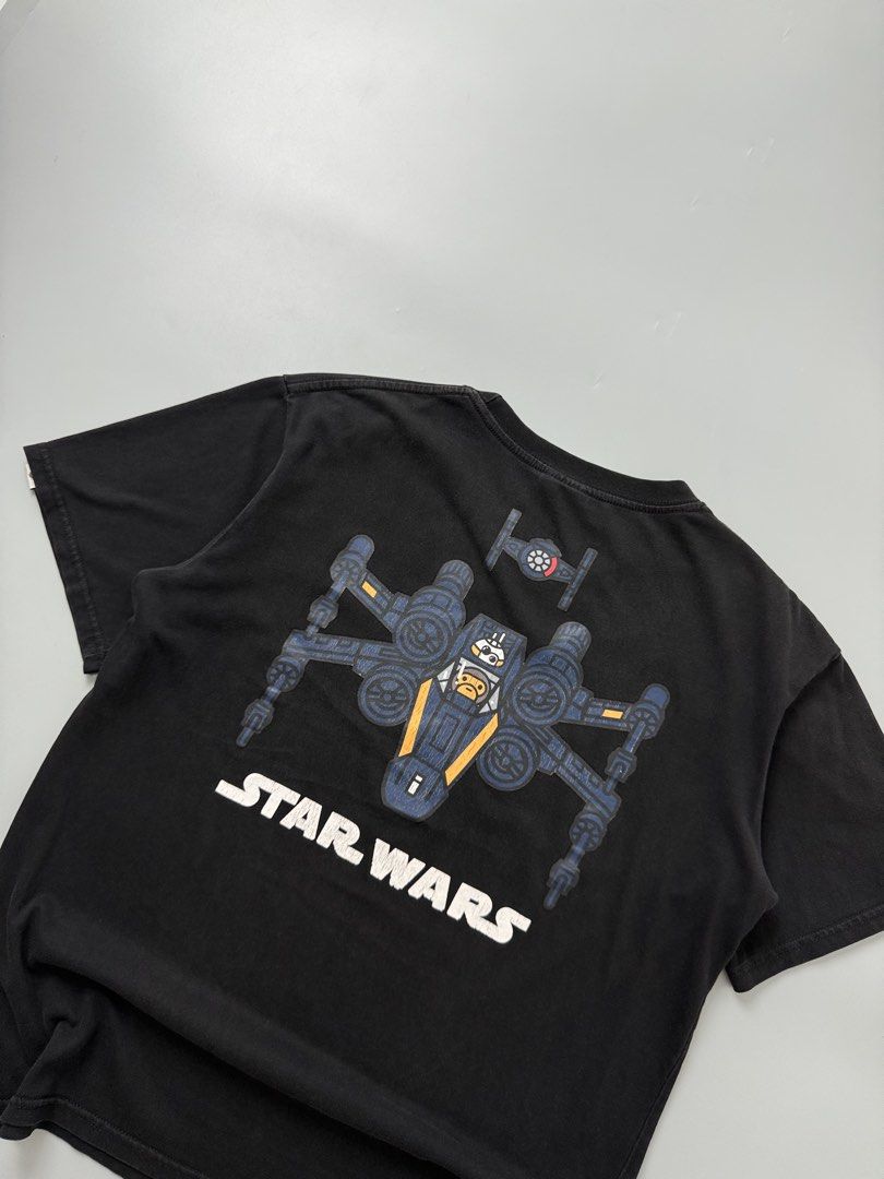 Bape x star wars (Category: Tshirts & Polo Shirts ) located in Pila. Submitted by villanueva80826 (Listing ID 1469525350, Image 2). Description: Bape x star wars Size:small •Width:21 •Length:25.5 •Condition:9/10 •Color rate:9/10 Mine:380 +Shipping fee Issue:sign of usage like hairline crack Still in good for psg condition Still wearable .