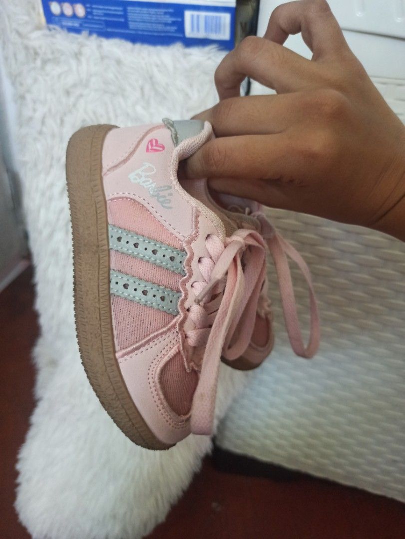 Barbie Pink Toddler Sneakers (Category: Babies & Kids Fashion) located in Manila. Submitted by loloeve12117993 (Listing ID 1469408924, Image 1). Description: - Adorable pink Barbie sneakers with matching laces - Classic casual design with signature Barbie branding on the side and inner sole - Cute tiny heart graphic near the heel - Durable brown rubber soles with grippy texture for active kids - Perfect for daily wear and little ones on the move.