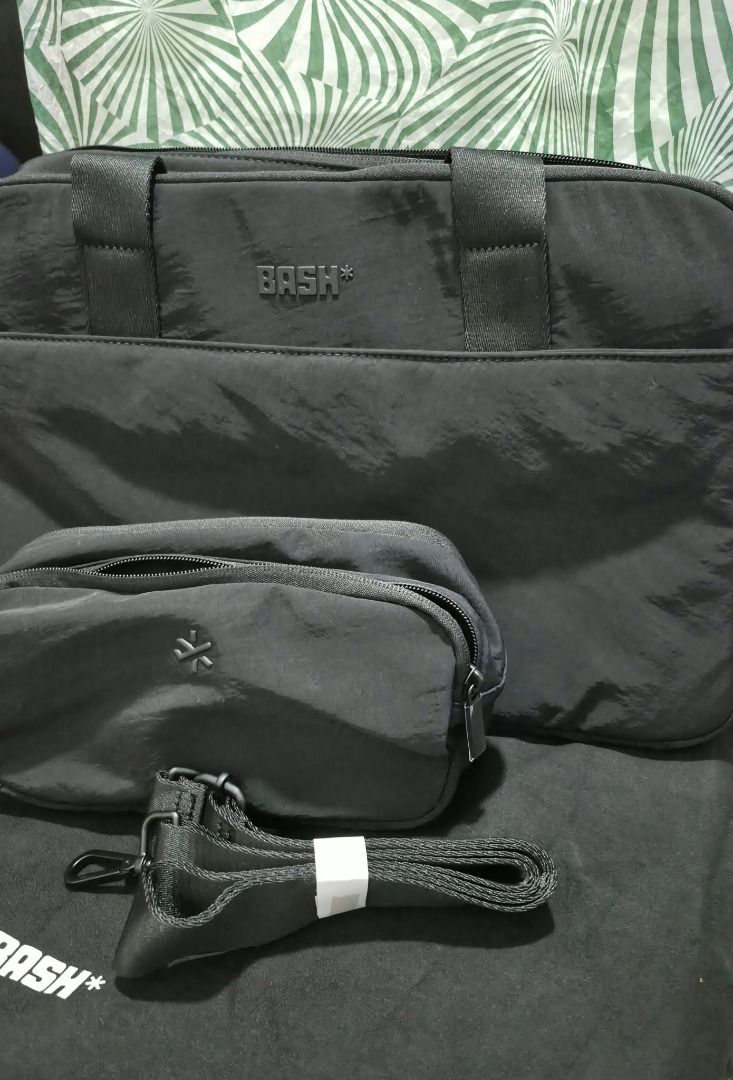 BASH black travel tote bag with pouch and strap (Category: Tote Bags) located in Pasig City. Submitted by loveMYshop2022 (Listing ID 1469498569, Image 1). Description: Bash Mini Weekender Carbon NO TO FAKE / DUPLICATE ITEMS +25.00 Add Paper Bag ✔️ORIGINAL ✔️BRANDNEW ✔️Limited Offer / limited Stocks Only 👍ready for pick up / on hand _ available 👍Location Pasig City 👍MOP Gcash / Maya / Gotyme / 👍CC Payment QRPH + 30.00 👍Feel FREE to Send Us DM
