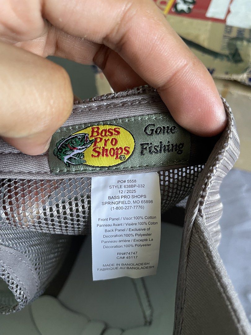 Bass Pro Shops Gray Trucker Hat (Category: Caps & Hats) located in Cagayan de Oro. Submitted by jekdels05 (Listing ID 1469407248, Image 3). Description: - Brand: Bass Pro Shops - Color: Gray - Condition: Brand new with original store tags attached - Material: 100% cotton front and visor, 100% polyester mesh back - Design: Classic trucker style with adjustable snapback closure and 'Gone Fishing' inner text - Style Number: 638BP-032.
