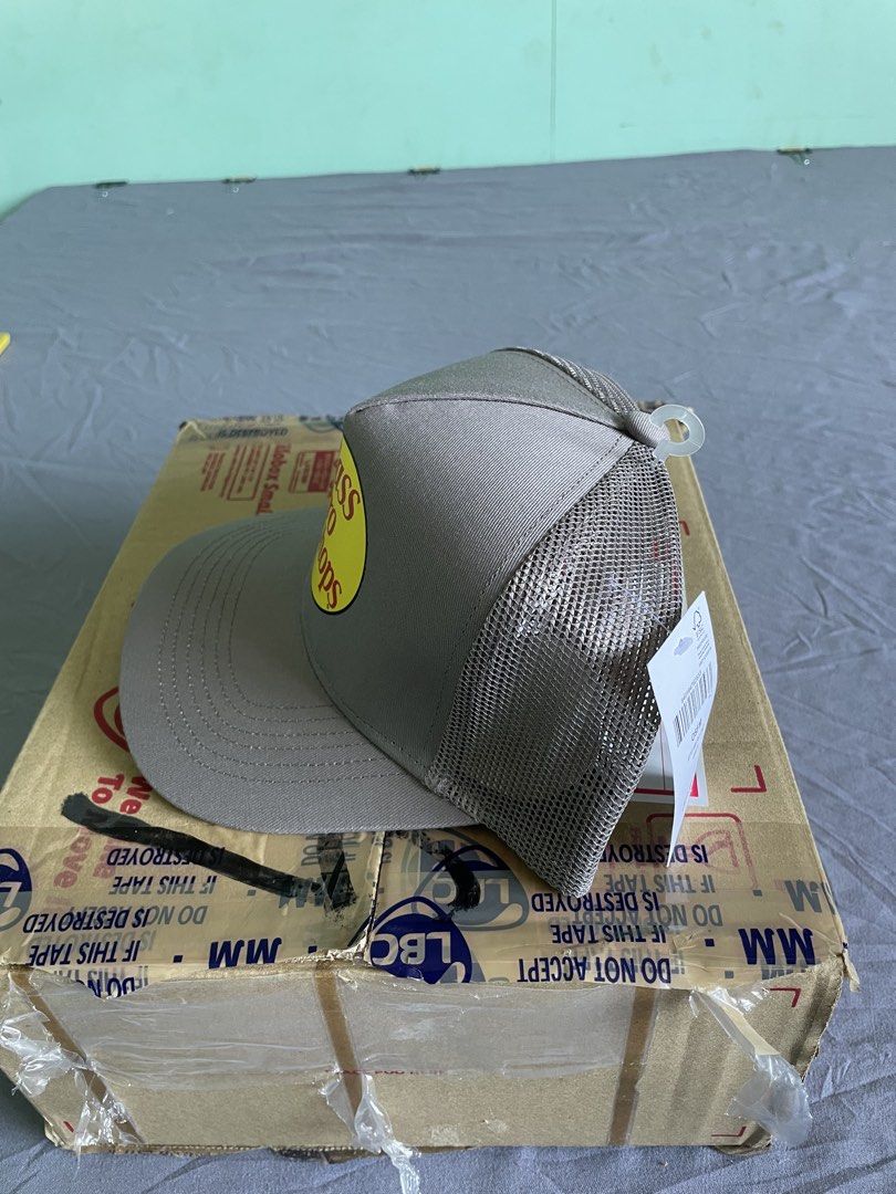 Bass Pro Shops Gray Trucker Hat (Category: Caps & Hats) located in Cagayan de Oro. Submitted by jekdels05 (Listing ID 1469407248, Image 2). Description: - Brand: Bass Pro Shops - Color: Gray - Condition: Brand new with original store tags attached - Material: 100% cotton front and visor, 100% polyester mesh back - Design: Classic trucker style with adjustable snapback closure and 'Gone Fishing' inner text - Style Number: 638BP-032.