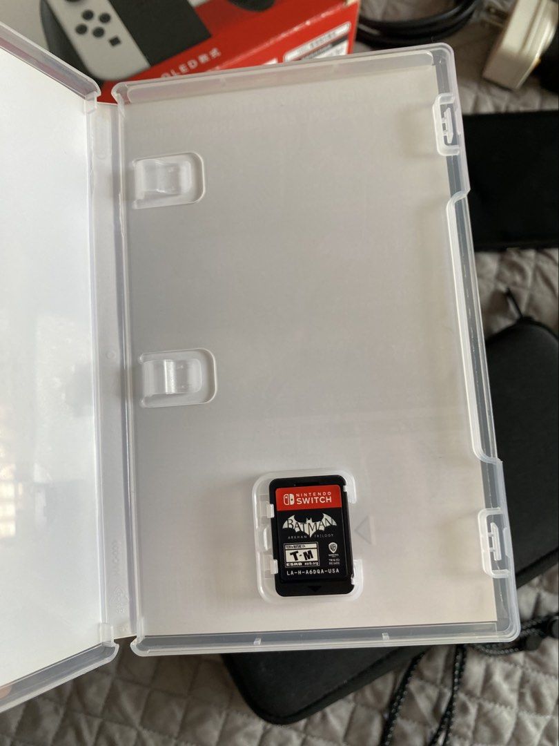 Batman Arkham Trilogy Nintendo Switch Physical Game (Category: Nintendo) located in Manila. Submitted by ims.sshi (Listing ID 1469456128, Image 3). Description: - Platform: Nintendo Switch - Title: Batman Arkham Trilogy (Asylum, City, and Knight) - Includes: All game-related DLCs - Condition: Tested and working perfectly - Inclusion: Cartridge and original case - Perfect bundle for action-adventure fans!.