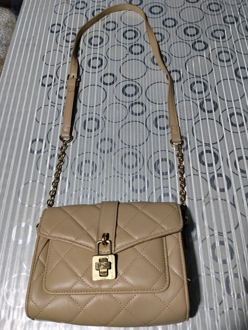 Bebe Sling Bag (Category: Cross-body Bags) located in General Mariano Alvarez. Submitted by iamnotjen (Listing ID 1469402697, Image 1). Description: Bebe sling bag Authentic from US preloved Fits Iphone 17 promax.