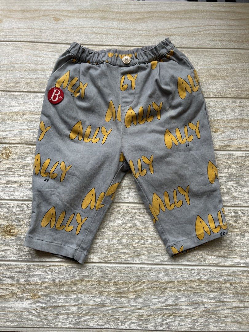 Bebedepino trousers (Category: Babies & Kids Fashion) located in Cebu City. Submitted by yjainani (Listing ID 1469409190, Image 1). Description: pair of grey children's trousers featuring an all-over yellow "ALLY" text print .