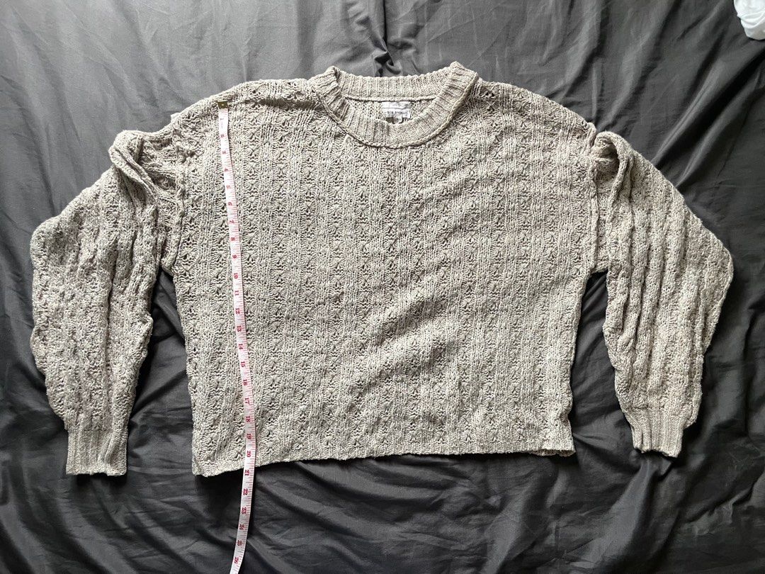 Beige Cropped Open Knit Crewneck Sweater (Category: Coats, Jackets and Outerwear) located in Mandaluyong City. Submitted by _javiii (Listing ID 1469415956, Image 1). Description: - Brand: Blu Pepper - Size: Fits M-L - Color: Neutral Beige - Style: Open-knit crewneck with relaxed drop shoulders and long balloon sleeves - Fit: Relaxed, approx. 24 inches pit-to-pit - Material: Lightweight, soft, and easy to layer over tees or tanks - Details: Ribbed