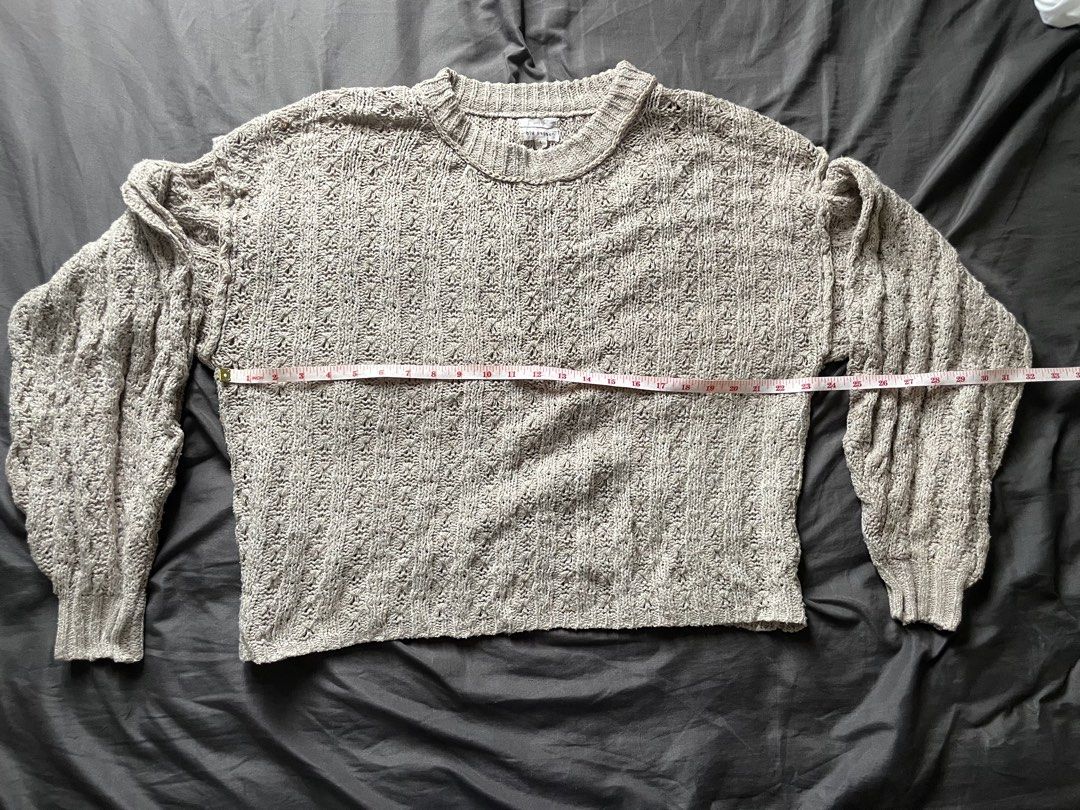 Beige Cropped Open Knit Crewneck Sweater (Category: Coats, Jackets and Outerwear) located in Mandaluyong City. Submitted by _javiii (Listing ID 1469415956, Image 2). Description: - Brand: Blu Pepper - Size: Fits M-L - Color: Neutral Beige - Style: Open-knit crewneck with relaxed drop shoulders and long balloon sleeves - Fit: Relaxed, approx. 24 inches pit-to-pit - Material: Lightweight, soft, and easy to layer over tees or tanks - Details: Ribbed
