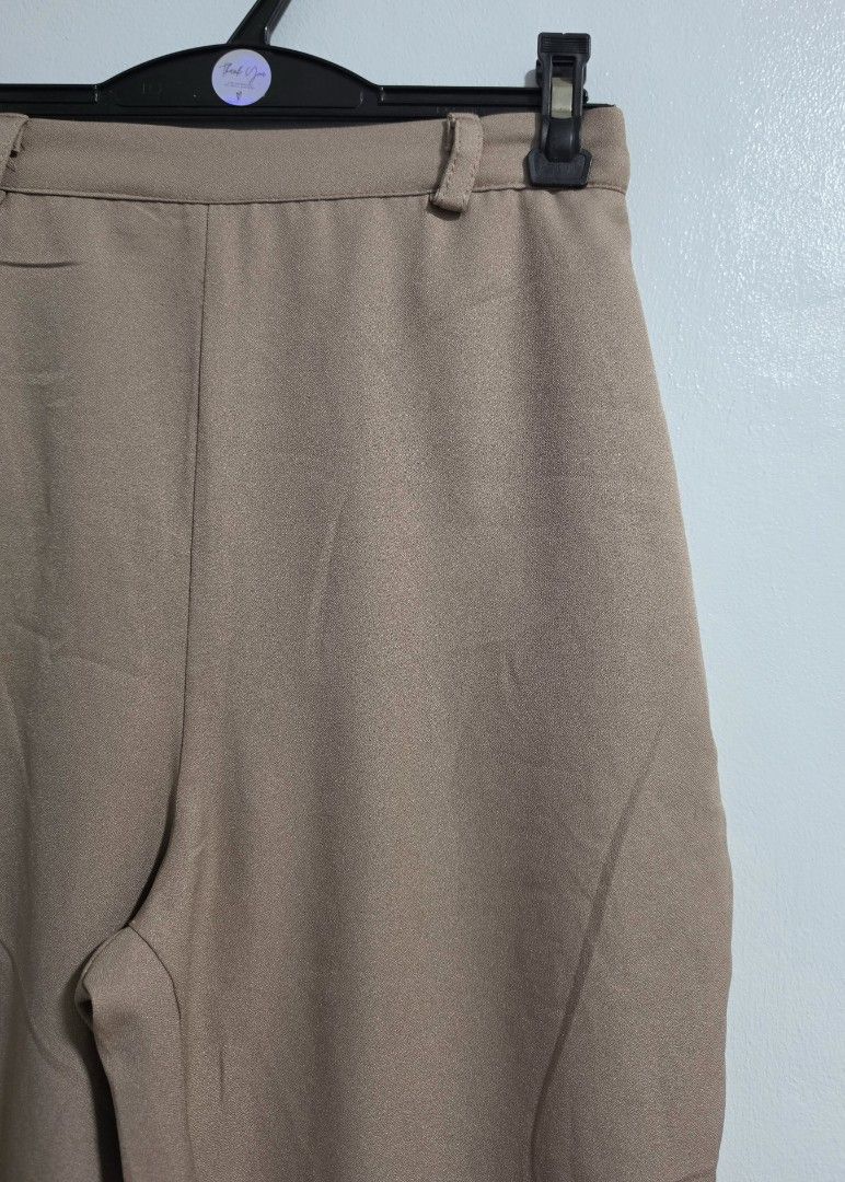 Beige High Waist Trousers with Pockets (Category: Jeans) located in Paranaque City. Submitted by franinnashop (Listing ID 1469476979, Image 2). Description: Declutter - Color: Versatile neutral beige - Fit: High waist with a clean front and comfortable elasticated back - Features: Functional deep side pockets and belt loops - Material: Smooth, high-quality fabric - Measurements: Waist 24 to 28 inches | Length 34.5 inches | Inseam 23 inches.