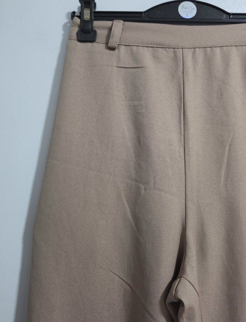 Beige High Waist Trousers with Pockets (Category: Jeans) located in Paranaque City. Submitted by franinnashop (Listing ID 1469476979, Image 3). Description: Declutter - Color: Versatile neutral beige - Fit: High waist with a clean front and comfortable elasticated back - Features: Functional deep side pockets and belt loops - Material: Smooth, high-quality fabric - Measurements: Waist 24 to 28 inches | Length 34.5 inches | Inseam 23 inches.